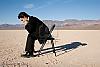 Bella giornata di volo-3031029-businessman-sitting-alone-empty-desert.jpg